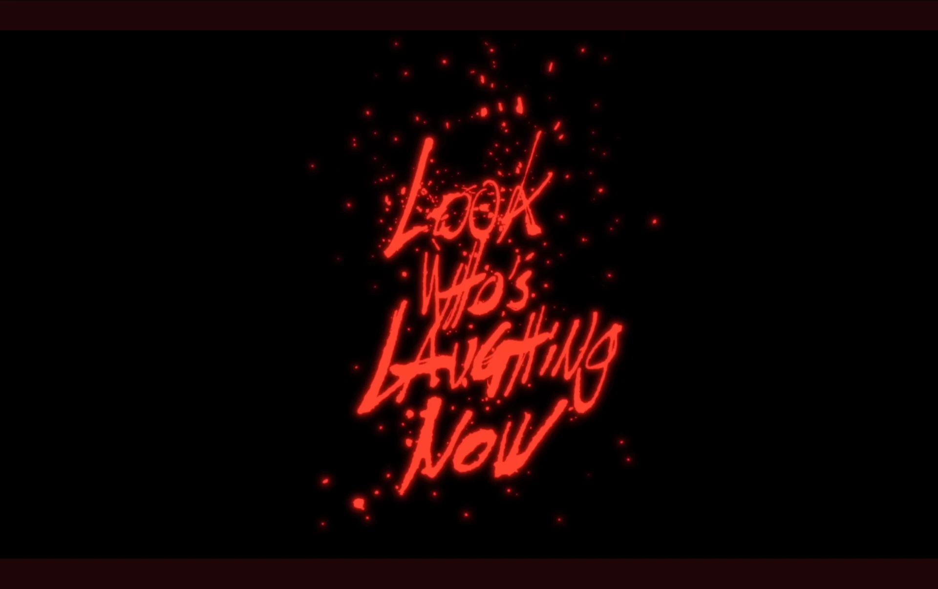 Music video frame with glowing red handwritten title lettering