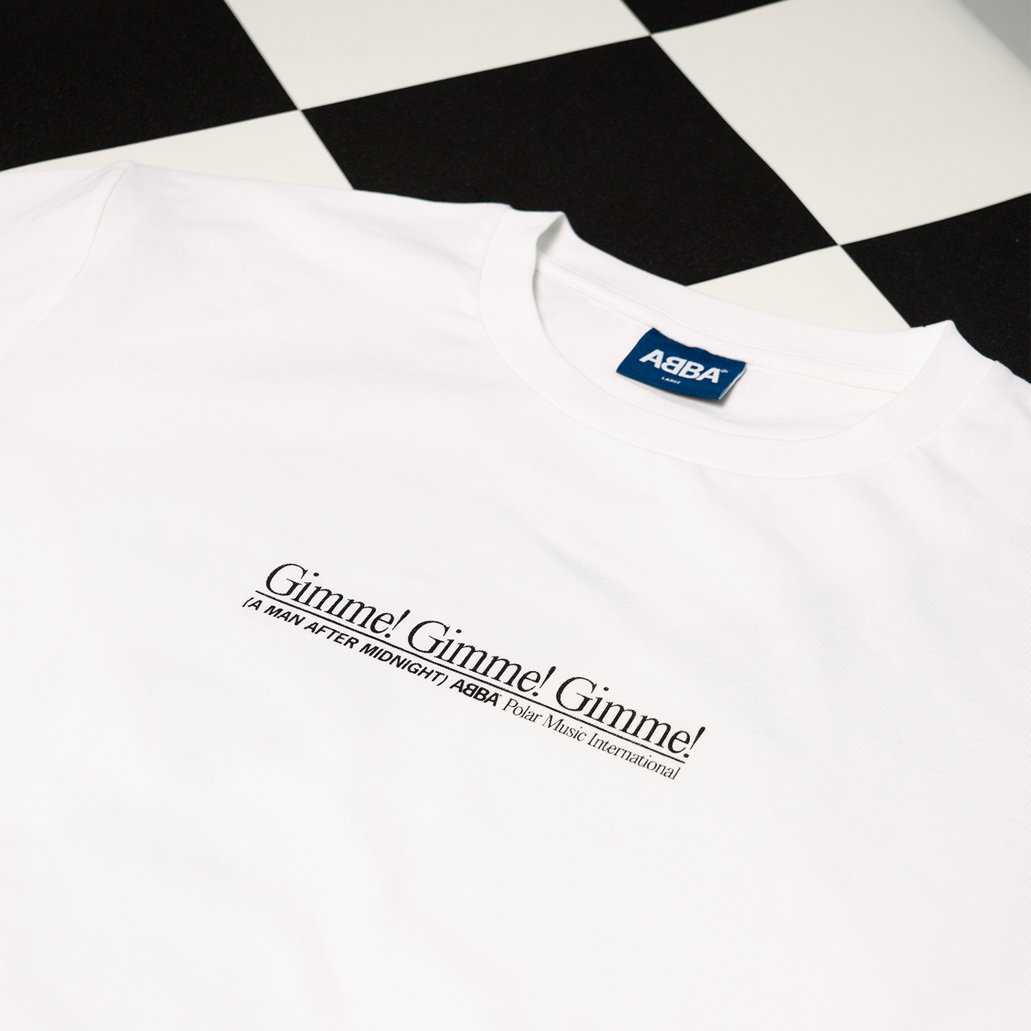 ABBA Gimme! Gimme! Gimme! white tee flat lay